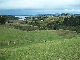 The Pacific Coast highway near Whitford has views of the surrounding countryside, farms, and Hauraki Gulf