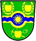 a fess nowy - Vert on a fess nowy ... a bar wavy nowy azure charged with a sun in splendour or - Town of Oliver, Canada