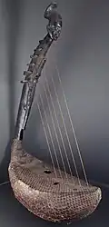 Sudan, Mangbetu people, intricately carved domu harp with snake skin.