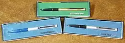 Three erasable pens in their cases.
