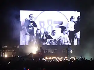 An 883 photo projected during a Max Pezzali concert in 2013