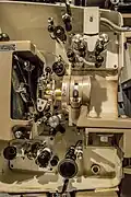 A detailed view of the mechanism, with the gate retracted. The projector is seen here in 35mm configuration.