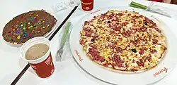 Chocolate spread with M&M-like confections (usually called confetes in Brazil) is a very common sweet topping combination