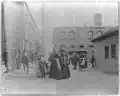 Quarantine station, Hoffman island, NYC-group of immigrants amid buildings