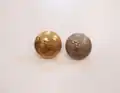 ROC metal tunic buttons (gilt Officer's button 3&nbsp;mm larger in diameter), depicting the Elizabethan Beacon Lighter in a coastal setting.