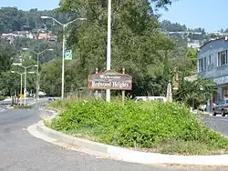 A sign welcoming motorists to Redwood Heights