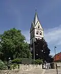 Saint Remigius's Church (Cath.) with Sebastian Münster statue