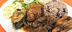 Costa Rican dinner from Puerto Limón (an area with Jamaican descendants)—gallo pinto served with various meats and accompaniments.
