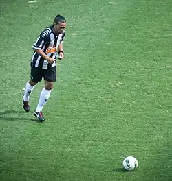 Footballer preparing to kick a ball
