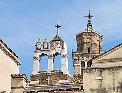 Leaning campanile, and empty bellcote