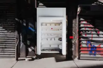Exhibit featuring white clothing arranged neatly in a closet