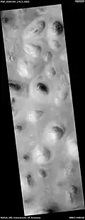 HiRISE image of Scandia Colles. Note the "basketball" texture caused by mantle of dust over surface.