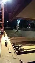 Bulk loading of a feeder ship with rapeseed meal