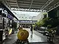 Restaurants and statue (2024)
