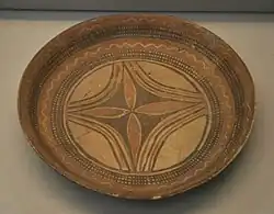 Dish with painted decoration, Late Halaf (c. 5600–5200 BC), Tell Arpachiyah. British Museum.