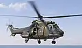 A Singapore Air Force Super Puma approaching USS&nbsp;Inchon