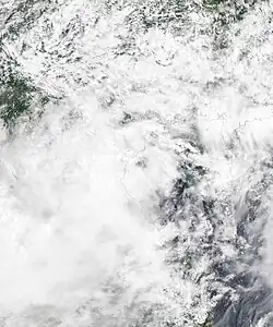 Satellite image of Sinlaku at peak intensity on August 2. The system had an exposed center at the time before moving inland.