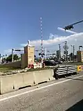 Photo showing a gate arm at the SW 200th Street intersection that will go down when a BRT vehicle is approaching.