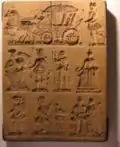 This mold shows a wedding carriage and many figures.