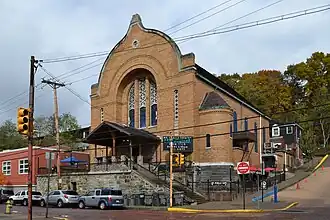 Mr. Smalls Theatre, a converted church building made of brick with a peaked roof. It is located on a corner in an low-urban environment.