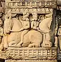 Indians riding horses.