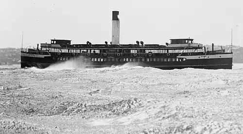 Crossing Sydney Heads early 1930s, after her wheelhouses were extended to provide officer accommodation