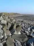 The shore at Gortan, Loch Indaal looking along the edge of the shore at low tide