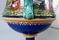 Tin-glazed Minton majolica, 1864, coated, brush-painted on flat surfaces, artist Rochfort. Possibly a combination of coloured glazes and tin-glaze decorated in enamels.