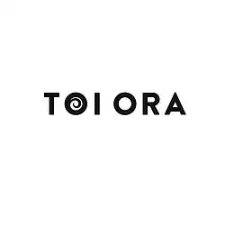Black writing of Toi Ora on white background