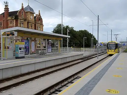alt=A photograph of rails at a train station.