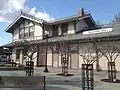 A two-story wooden railroad station building