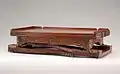 This ca. 1700–1720 table, designed for coach travel, folds out to accommodate six for dinner (with utensil drawer and fiddle rails) and offers felt and leather surfaces for playing cards and writing, respectively.[10]