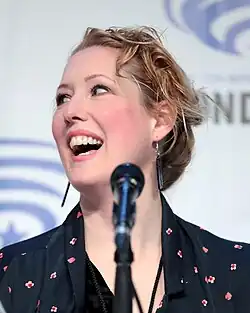 Tula Lotay looking up and smiling