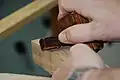 A mortise gauge being used