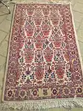 A carpet with Zell ol Soltan motif