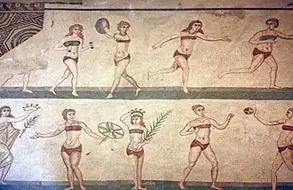 This mosaic, called the Coronation of the Winner and nicknamed the bikini girls, shows Roman women engaged in athletic activities such as swinging a discus, hitting a ball to each other, and stepping whilst using dumbbells. Villa Romana del Casale, 4th century AD.