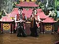 Water puppeteers Phan Tranh Liem and his wife in waders, Hanoi, 2017