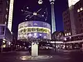 The world time clock by night at Alexanderplatz in Berlin. July 2018.