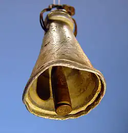 Improvised cowbell for sheep or goats, found in 1988 near Tuqu', the West Bank. The aluminium bell's body is probably a broken kitchen utensil, while the clapper is a brass cartridge case (SMI 25 NATO, probably 7.62×51mm).