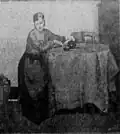 Woman at table, by Myon G. Barlow